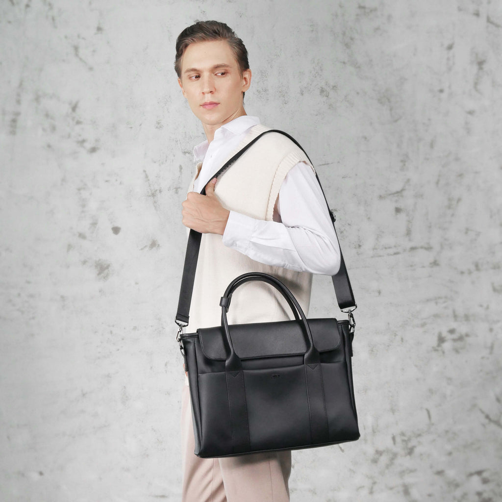 Man in suit carrying Aurelius Briefcase to office