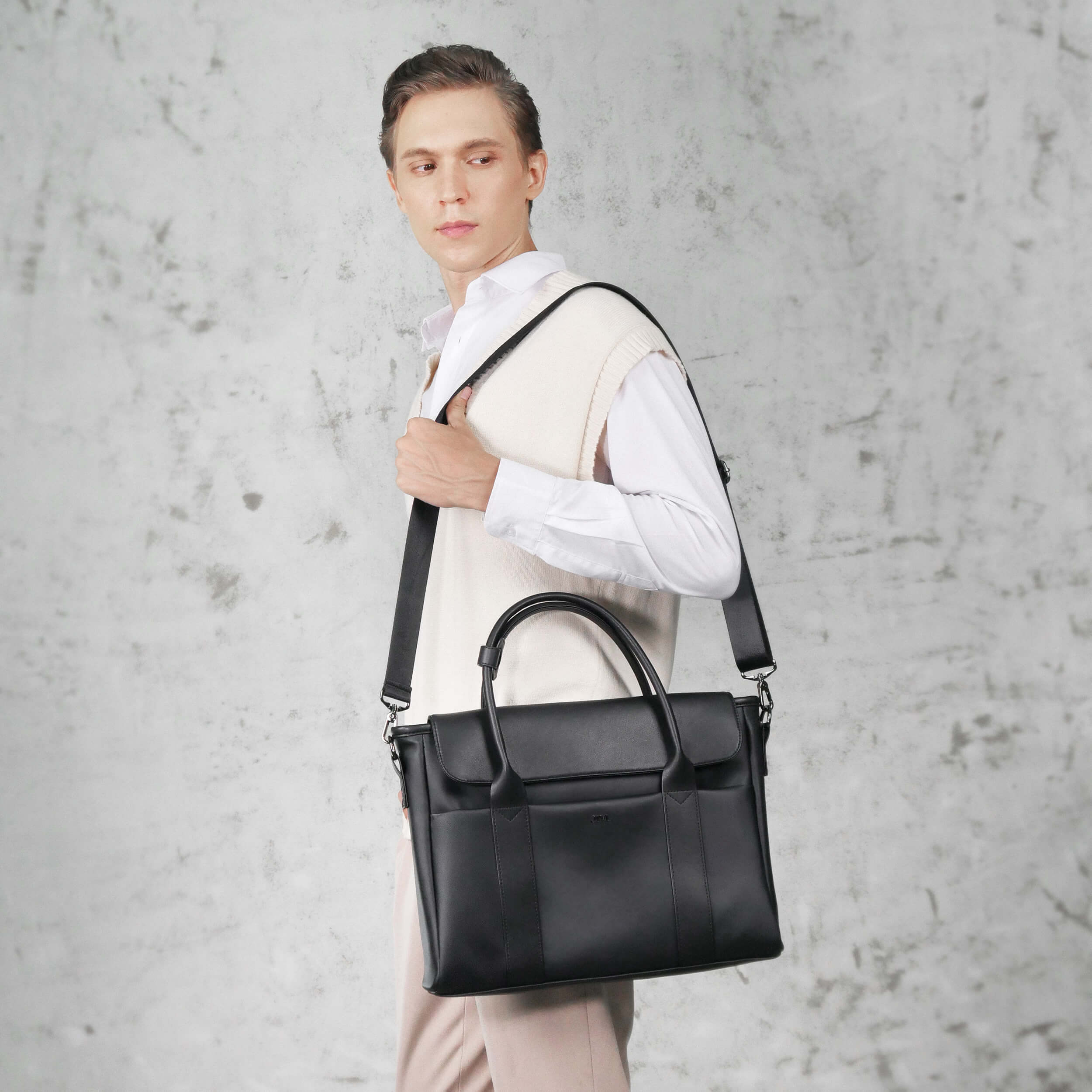 Man in suit carrying Aurelius Briefcase to office